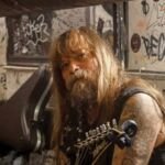 chris holmes sitting with his guitar 1200x900 1